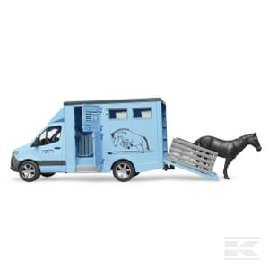 A toy MB Sprinter animal transporter featuring a detachable ramp and accompanied by a black toy horse positioned to walk up the ramp, from the Bruder brand, model U02674.