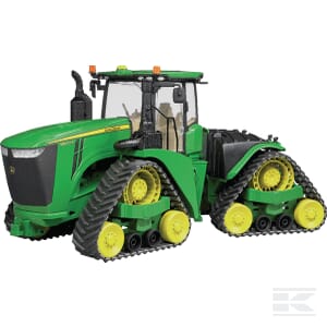 A John Deere 9620RX - U04055 agricultural track tractor by Bruder, featuring a green and yellow color scheme and equipped with four large tracks, two on each side.