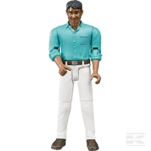 A Bruder Man (white jeans) - U60003 plastic doll with dark hair, wearing a teal shirt, white pants, and brown shoes, standing upright with movable limbs and head.