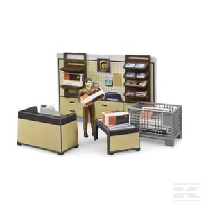 The Bruder UPS Store - U62250 is a detailed miniature model featuring shelving, packages, accessories, a counter, and a figure in a brown uniform holding a package.