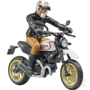 This Bruder Ducati Desert Sled + Driver (U63051) toy figure features a motorcyclist dressed in black gear and brown pants, with a white helmet adorned with red stripes, posed in an action-packed riding stance atop a sleek white Ducati.