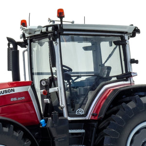 A close-up view of the cabin and driver's seat inside a red Limited Edition Massey Ferguson 8S.305 farming tractor with black and white accents from JMCE DEALS. Winner Tractor of the Year 2021, this tractor boasts large black tires with light gray rims, clear cabin windows, and safety lights mounted on top of the cabin.