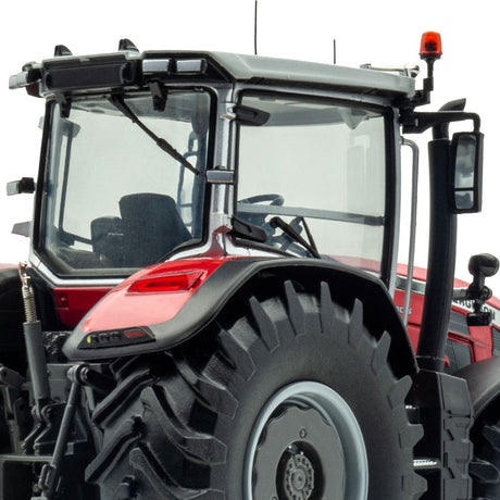 Close-up view of the rear cab of a Limited Edition Massey Ferguson 8S.305 500 pcs (UH6676C) from JMCE DEALS, showcasing its large black tires with light gray rims, back window, and attached equipment.