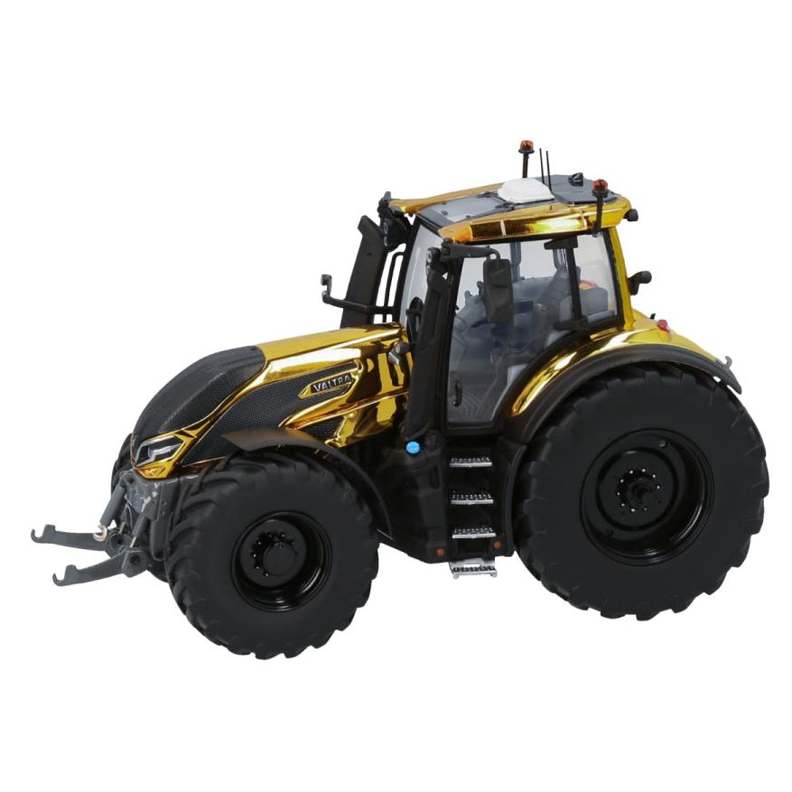 A large, black and gold AGCO Valtra Q305 Gold Limited Edition (V42803530) tractor with oversized wheels and steps leading to the cab, shown on a white background. This collectible scale model captures every intricate detail perfectly.