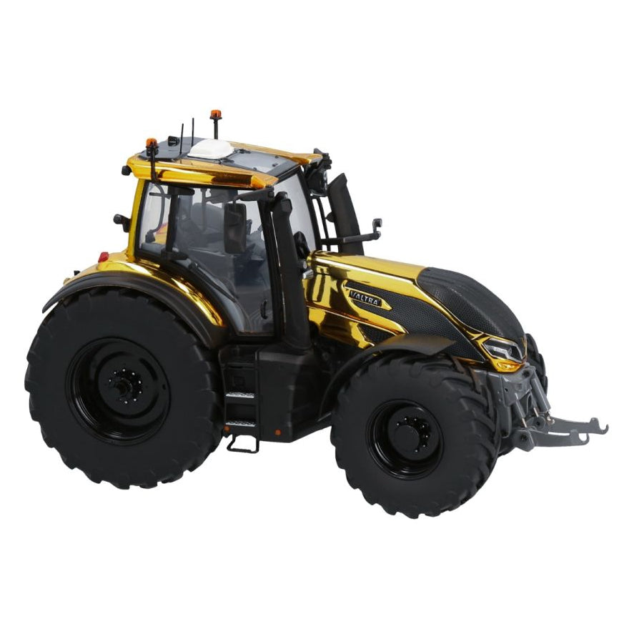 The AGCO Valtra Q305 Gold Limited Edition (V42803530) collectible tractor is showcased. This gold and black scale model features large wheels, side mirrors, and multiple lights on the roof, presented from a side angle against a plain white background.