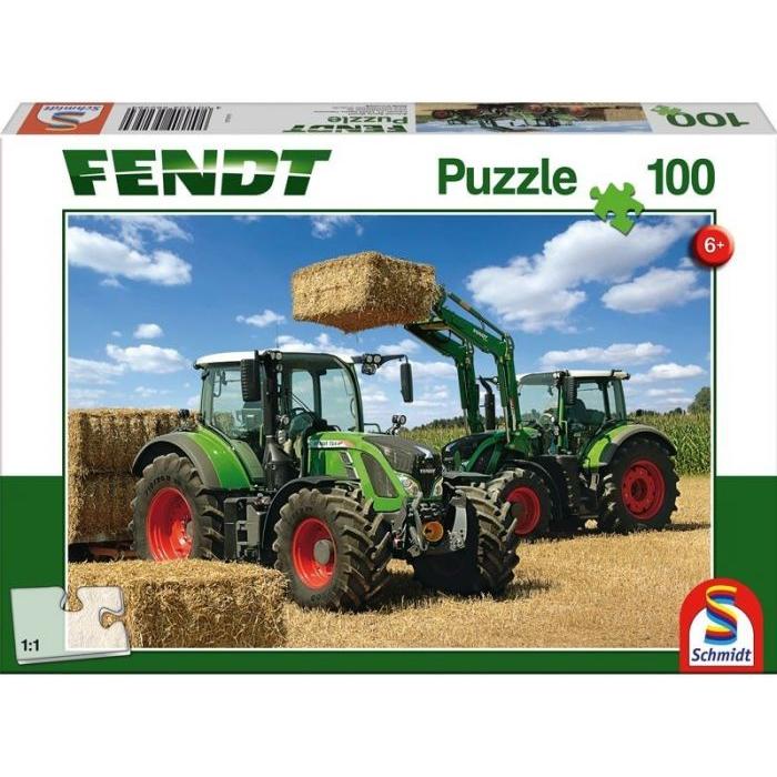 The Fendt - 100-Piece Jigsaw Puzzle - X991017198000 by AGCO features a puzzle box cover depicting two green tractors in a field, with one tractor lifting a hay bale. Suitable for ages 6 and up, this puzzle includes the iconic Fendt 724 Vario.