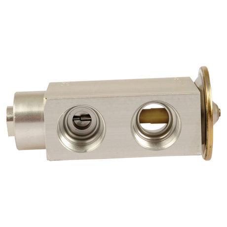 The O Ring Type Expansion Valve, Sparex Part No. S.106832, is a metal block component with two cylindrical holes and a brass fitting on one end, commonly used in mechanical or fluid systems applications such as the Deutz-Fahr AGROPRIMA.