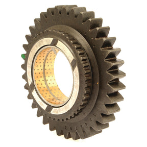 A close-up of the Sparex Transmission Gear - 12 Speed (Sparex Part No. S.107317) with angled teeth and a hollow center, reminiscent of classic Massey Ferguson tractor parts, against a white background.