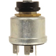 A cylindrical metal electrical component with four terminal connectors at the base, and a black plastic cap with a hexagonal brass nut around the middle, the Sparex Ignition Switch (Part No. S.107587) is compatible with Ford/New Holland and Fiat vehicles.