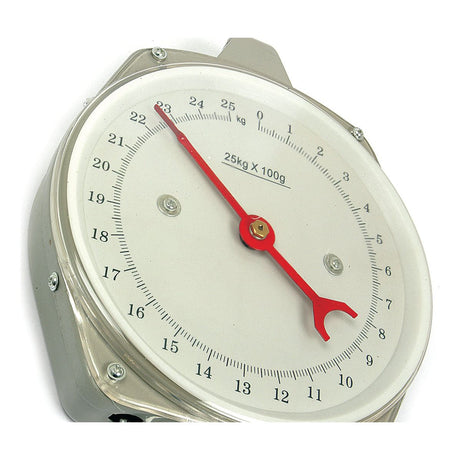 A close-up of the Sparex SCALE-25KG/100G 55LB/4 OZ - S.10841 analog kitchen scale, known for its robust construction and reliable spring balance mechanism, features a red pointer indicating a weight just above 20 kilograms. The scale displays measurements on a white dial with black numerals and markings.