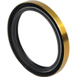 Close-up of a Seal | Sparex Part No. S.108421 from the brand Sparex, featuring a gold-colored outer edge and a black inner ring that brings to mind parts from Case IH. The seal seems to be composed of metal and rubber components.