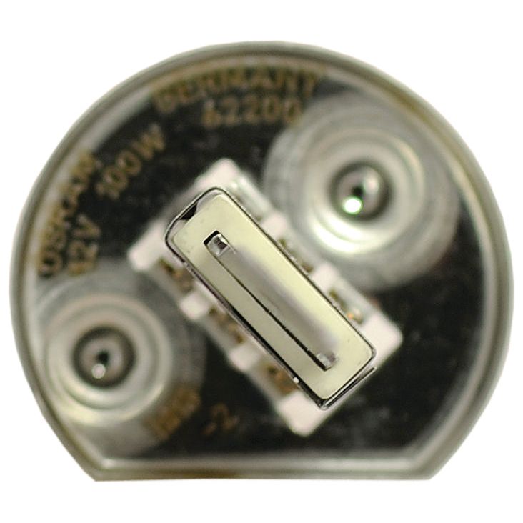 Close-up of a clear Sparex Light Bulb (Halogen), 12V, 100W, P14.5s showing the two contact pins and internal filament structure. The text "12V 100W" and "Germany" are visible on the metal base.