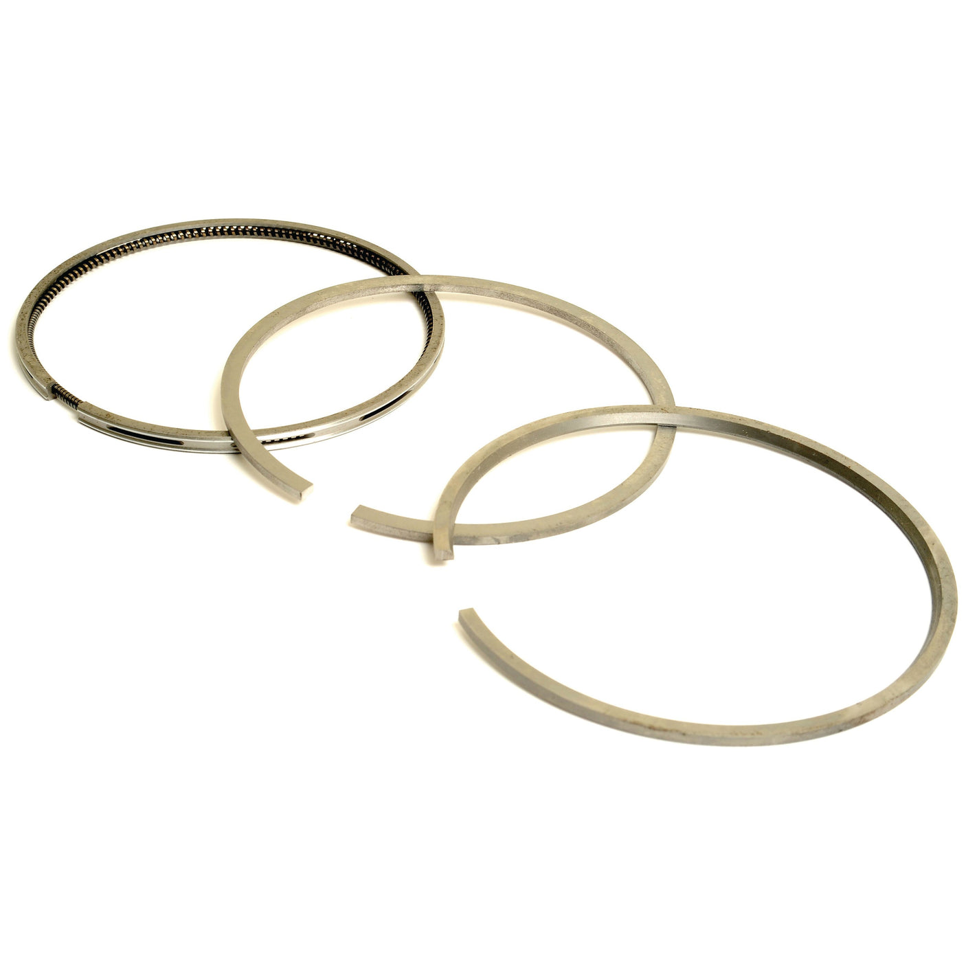 Three metal piston rings of varying diameters, arranged in a triangular layout on a white background, symbolize the precision engineering found in the Sparex Piston Ring | Sparex Part No.S.110974.