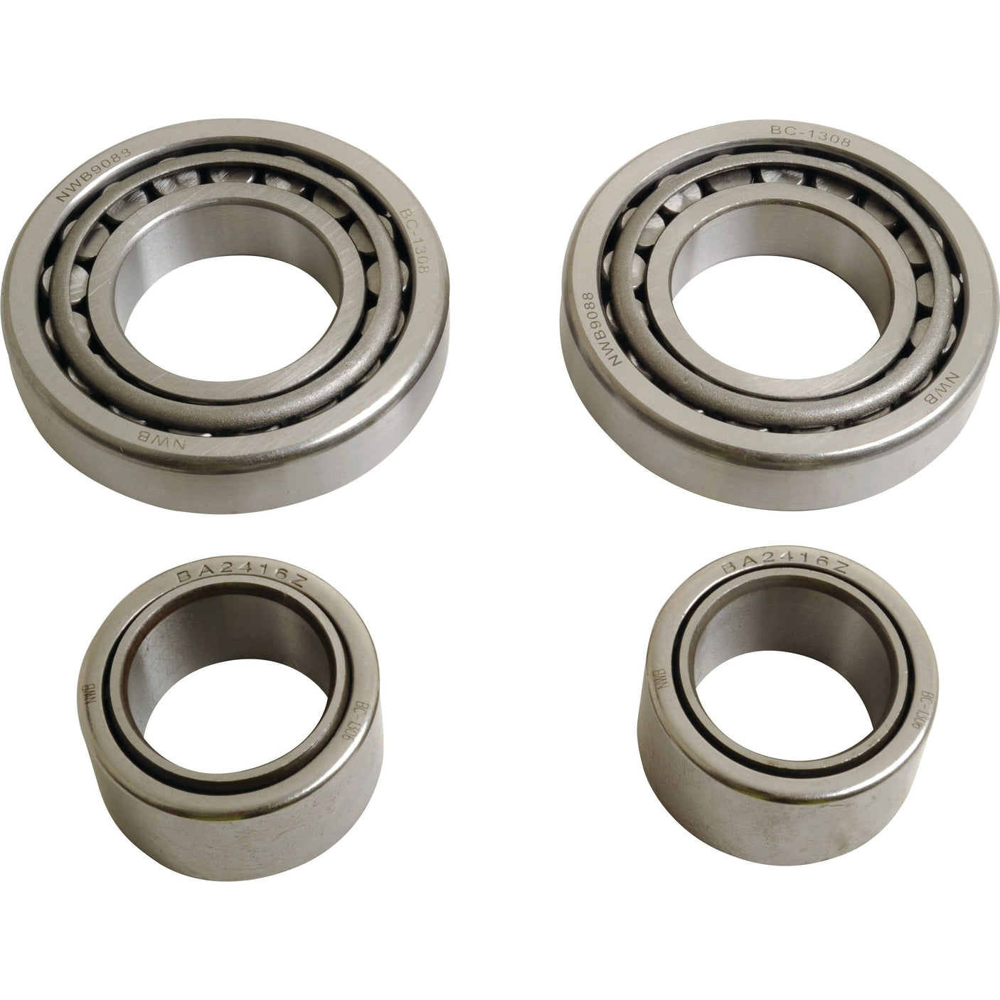 Four metal bearings of different sizes are arranged on a white surface. Included in the arrangement is the King Pin Repair Kit from Sparex, known under Part No. S.111021. The larger pair, reminiscent of Valtra machinery components, comprises an inner and outer bearing, while the smaller pair features a similar inner and outer bearing configuration.