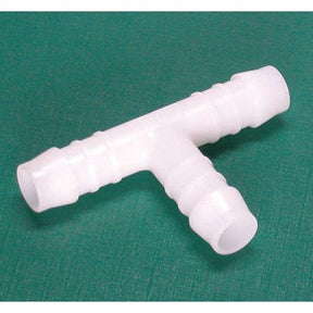 A Sparex Hose Connector T-type TS 3x3mm, made of white plastic, on a green background—an ideal fitting for brake fluid systems.
