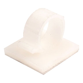 The Sparex Adhesive Cable Clip 18MM DIA - S.11301 is a white nylon plastic clip with a self-adhesive base, designed for superior cable retention and easy organization on flat surfaces.