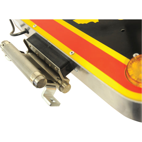 Close-up of a metal bracket and hinge assembly attached to the Sparex LED Triangle Warning Light (Product S.114412) featuring red, yellow, and black colors with an orange reflector, highlighting the LED light with an IP44 rating.