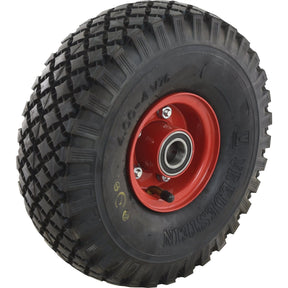 A close-up view of the Sparex Complete Wheel (Product Code: S.137656) showcases a black rubber tire with a red metal rim, featuring the V76 Diamond tread pattern that is ideal for rough terrain.