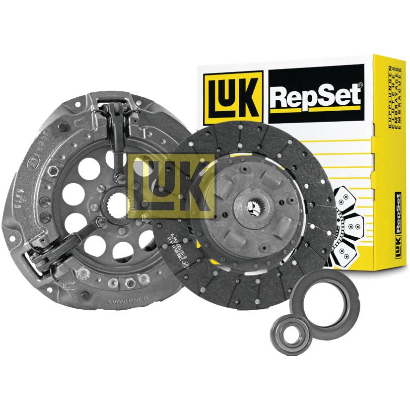 A Sparex Clutch Kit with Bearings - S.146829, featuring a pressure plate, clutch disc, and release bearing with a standard damper, displayed next to its yellow and white packaging.