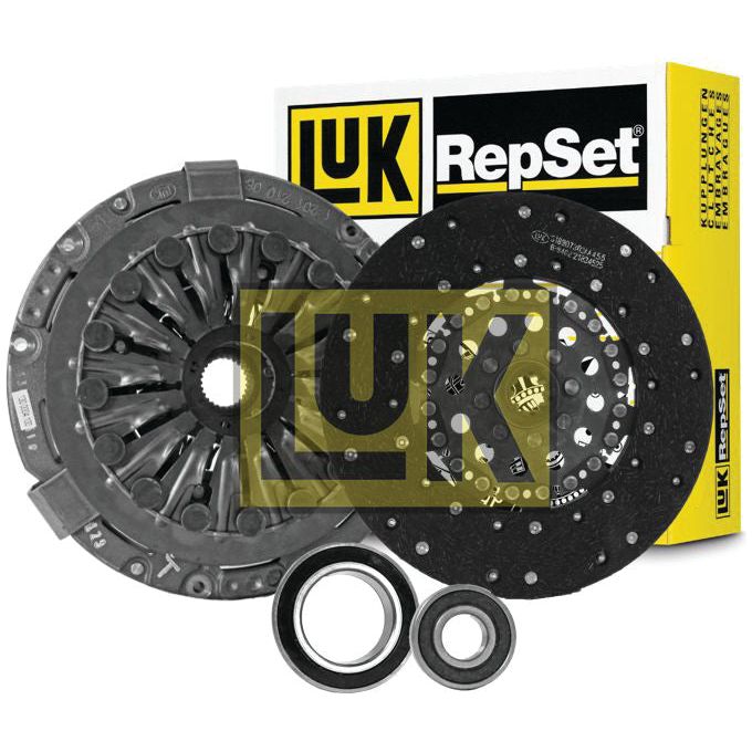 A Sparex Clutch Kit with Bearings - S.146874, featuring a cast iron pressure plate, clutch disc, release bearing, and pilot bearing, is shown with its packaging in the background.