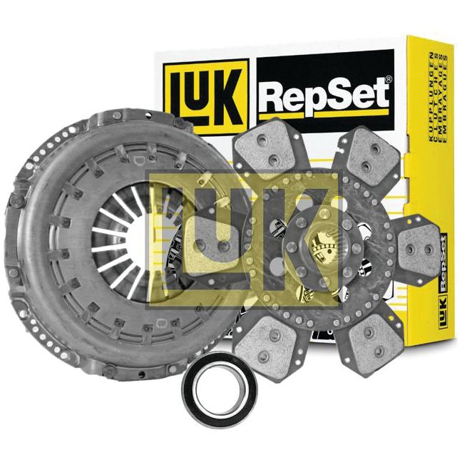 A Sparex Clutch Kit with Bearings - S.146940, featuring a cerametallic material and cover size of 310mm, including a pressure plate, clutch disc, and release bearing is displayed in front of its yellow and black packaging.