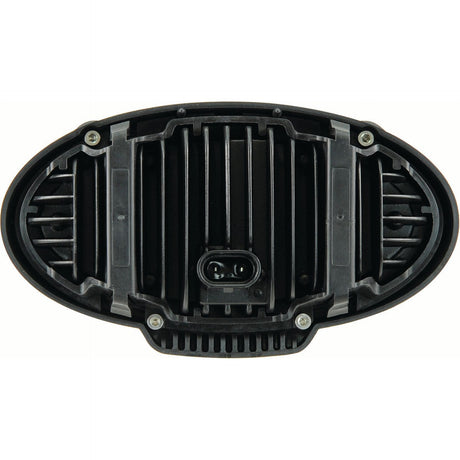 The John Deere LED Work Light by Sparex, featuring a black plastic oval-shaped component with a central DT connector and multiple slots, is securely fastened with four screws at each corner. Rated IP69K for high protection, this 4100 lumens raw light is ideally suited for rugged environments requiring robust LED worklight installations.