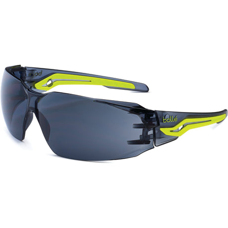 A pair of Sparex Safety Glasses, model SILEX - S.162025, featuring smoke grey lenses and yellow and black accents on the arms, offering ultra-wraparound protection.