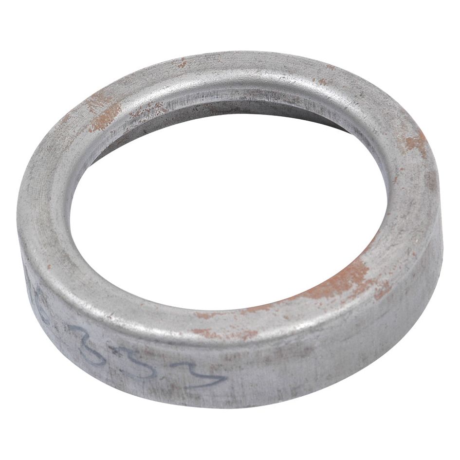 A metal ring from Sparex, Part No. S.16333, with a slightly worn surface and minor rust spots, once served as a dust cover for antique Massey Ferguson equipment.