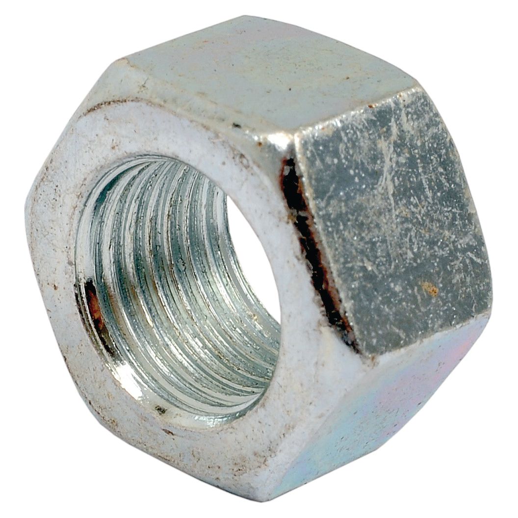 Close-up of a Sparex 1/2'' UNC Imperial Hexagon Nut (DIN 934) with internal threading, tensile strength of 8.8, often used for fastening to a bolt, commonly found in Massey Ferguson machinery. The surface shows slight wear and discoloration.