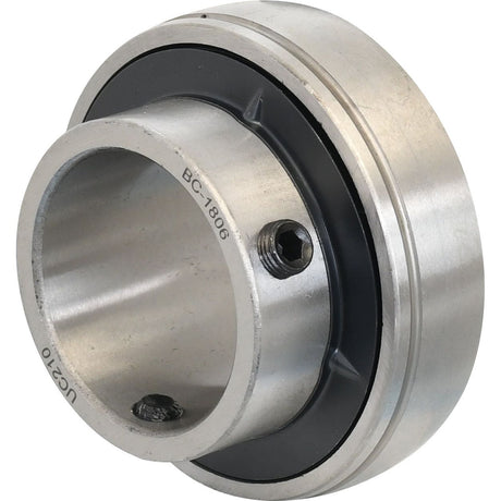 A close-up image of a Sparex Plummer Block Bearing Insert (UC210) - S.18436, featuring cylindrical and circular components, a set screw, and engraved markings including "UC 210" and "BC1806.