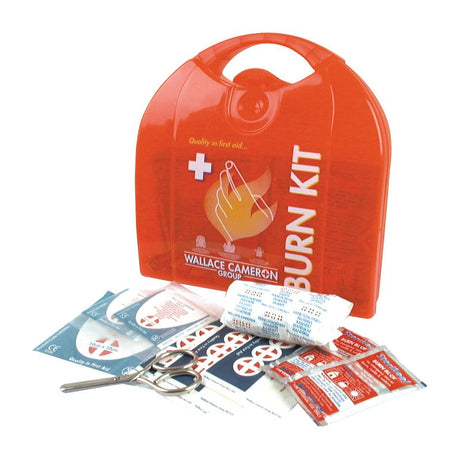 A First Aid Kit, branded as Sparex (Part No.S.18816), containing bandages, scissors, non-adherent dressings, burn gel packets, and other first aid supplies is neatly placed in front of a red plastic carrying case labeled "Burn Kit.