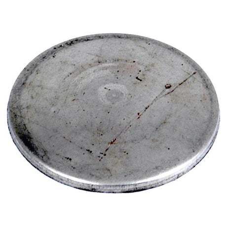 A round, flat Core Plug - 1 1/4'' (Dished Type - Mild Steel) from Sparex with a slightly textured surface and a visible scratch.