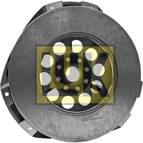 A circular metal clutch plate, bearing the Sparex brand name and identified as Clutch Cover Assembly - S.19553, features a central hole and multiple smaller holes with a yellow and black "LUK" logo overlay in the center. This assembly is paired with a flywheel potted housing and has a cover size of 300mm.