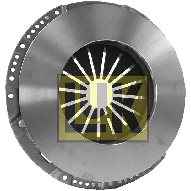 Close-up of a metallic automotive component with a central circular opening, surrounded by evenly spaced slots. It features a partially overlapping logo displaying the letters "Sparex" in bold yellow and black font. This Clutch Cover Assembly - S.19661 boasts a single cover size of 350mm for optimal performance.