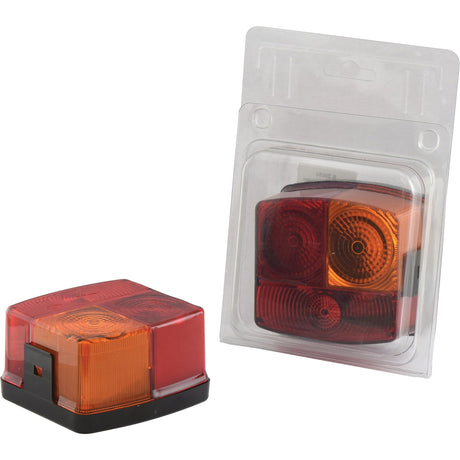 The Rear Combination Light from Sparex, with product code S.20050 functions as a brake, tail, or indicator signal with halogen illumination. This versatile 12V light features red and amber lenses and is shown both inside and outside its packaging.