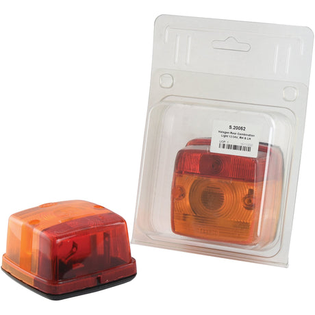 Two orange and red trailer lights are shown. One, with a robust polycarbonate lens, is outside its packaging, while the other remains inside a clear plastic package. These Sparex Rear Combination Lights (Halogen), featuring two functions for both right-hand and left-hand sides at 12V (S.20052), ensure durability and reliability for your trailer needs.