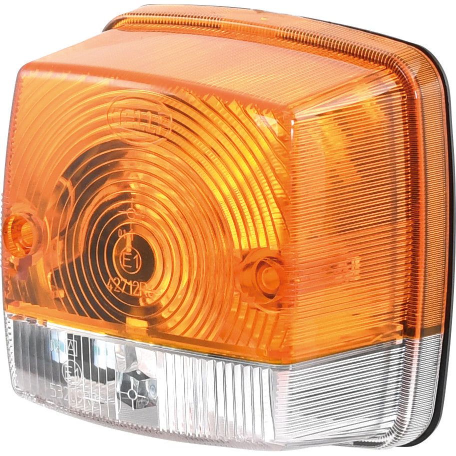Close-up of a Sparex Rear Combination Light, featuring both amber and clear rectangular sections with circular and linear patterns on its surface.