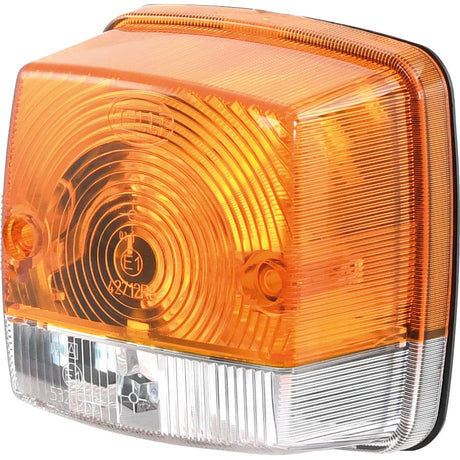 Close-up of a Sparex Rear Combination Light, featuring both amber and clear rectangular sections with circular and linear patterns on its surface.