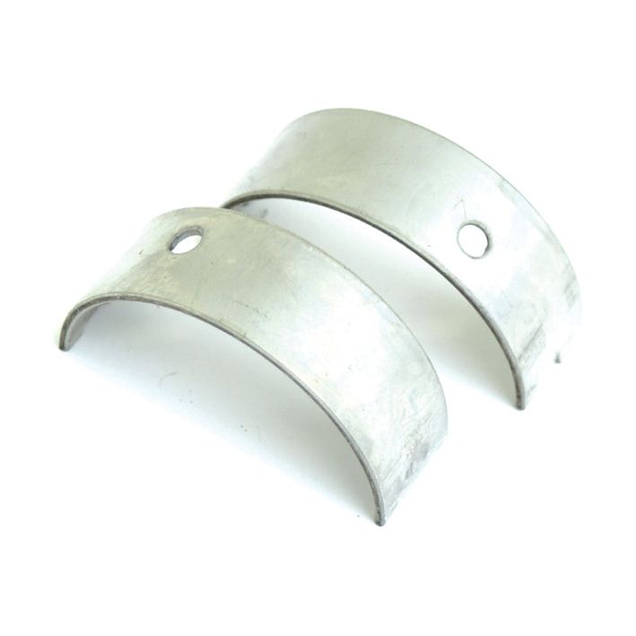 Two curved metallic bearing shells with holes, placed parallel to each other on a white background—perfect tractor parts compatible with John Deere equipment. Presenting the Main Bearing Std. (Pair) from Sparex, Part No.S.20801.