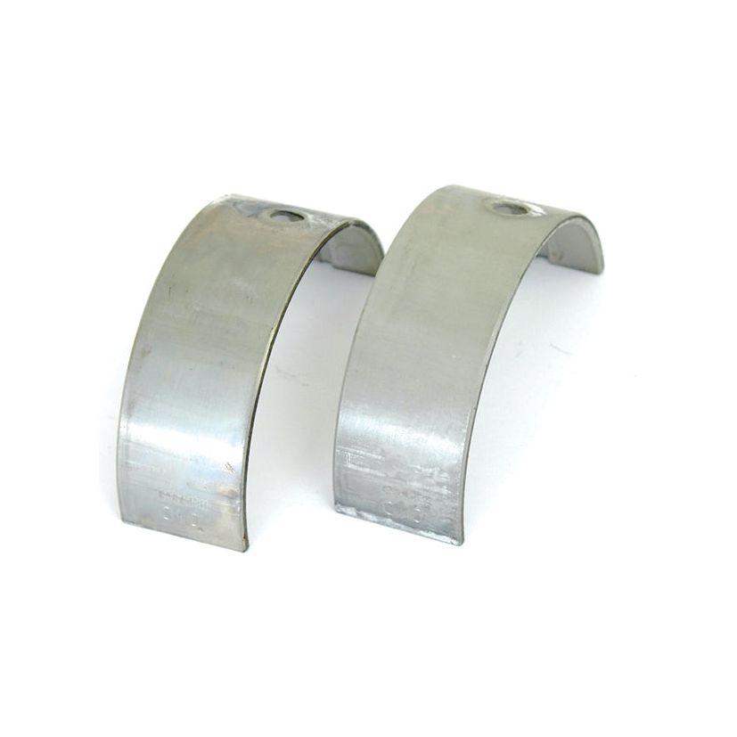 Two metallic, curved Main Bearing +0.010'' (0.25mm) shells with holes on top, resembling Sparex Part No.S.20802 main bearings, are placed side by side on a white background.