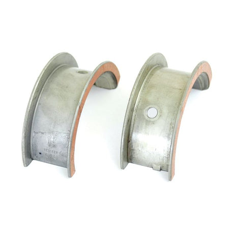 A pair of main engine bearing shells, identified as Main Bearing +0.010'' (0.25mm) (Pair) with Sparex Part No.S.20942, are displayed on a white background with a copper-colored inner lining. One shell features a small circular hole and is marked 0.25mm for precision. These high-quality bearings from Sparex are compatible with John Deere machinery and available through Sparex.