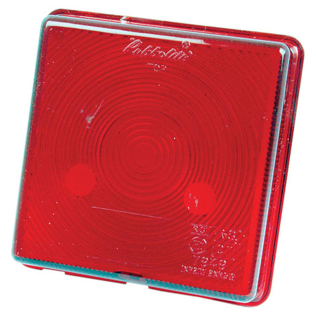 The Sparex Replacement Lens (Sparex Part No. S.21844), a square red reflector featuring concentric circle patterns on a flat surface, is constructed from durable polycarbonate and is commonly used to enhance visibility on bicycles or vehicles.