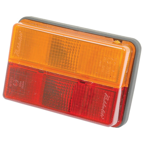 The Sparex Rear Combination Light (Halogen), product code S.21845, features a rectangular design with an amber upper section and a red lower section, mounted on a gray base, making it ideal for use as a brake, tail, or indicator light for trucks.