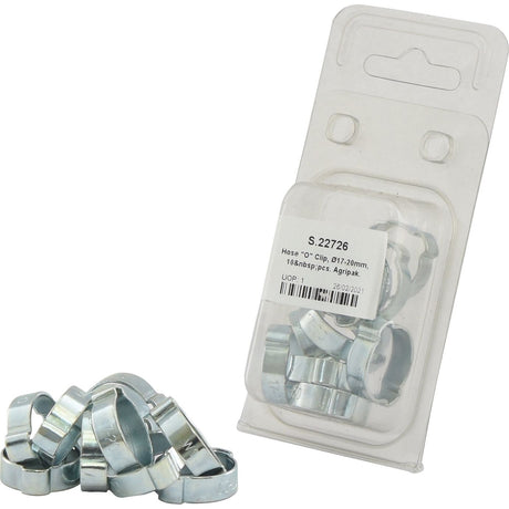 A bundle of metal hose clips on a white surface sits next to a packaged set labeled "Hose 'O' Clip, Ø17-20mm, 10 pcs. Agripak" by Sparex, Part No. S.22726.