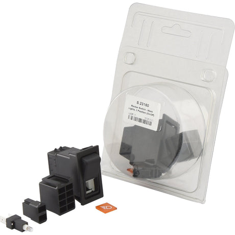 Image of a 12V Sparex Rocker Switch - Work Lights, 2 Position (On/Off) (S.23160) with its components, including mounting hardware, placed in front of a partially opened plastic packaging. The packaging displays a label with the product code S.23160 and an IP65 rating.