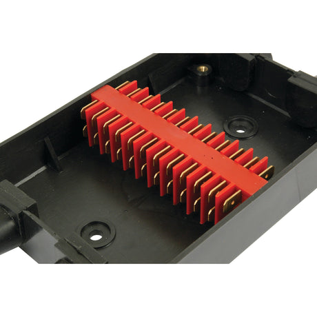 A rectangular black plastic junction box, branded Sparex Part No. S.23689, featuring 12 terminals and housing a red component with gold-colored metal connectors arranged in parallel.