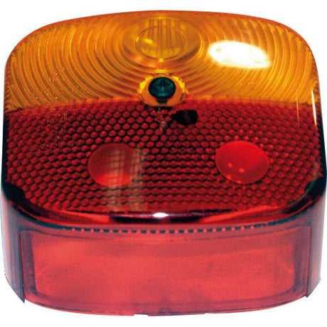 Close-up of the Replacement Lens (Fits: S.26071 | Sparex Part No. S.26076) by Sparex featuring a vehicle rear light with amber and red sections, equipped with a polycarbonate reflector and two circular light elements.