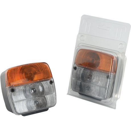 The Sparex Front Combination Light (Halogen), 12V, RH & LH, Straight (Part No. S.26263) features two vehicle lights with amber and clear lenses. One light is unpackaged while the other comes in clear plastic packaging, making them an ideal option for a 12V front combination light setup.