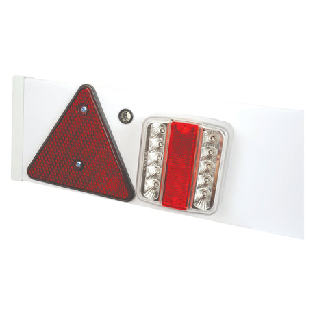 The LED Lighting Board by Sparex, featuring a white panel with a red triangular reflector and red and clear rectangular lights, is shown against a white background. This versatile board provides four functions: brake light, tail light, indicator light, and number plate illumination. It also comes equipped with a 12V LED Plug and has an IP67 rating for weather resistance. The product code for this model is S.26298.