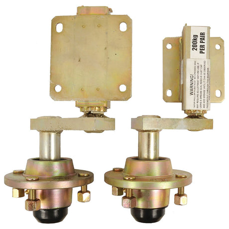 A pair of SUSPENSION UNITS (Sparex Part No. S.26715) from Sparex, each with a maximum load capacity of 200 kilograms per pair, featuring a gold-colored finish and attached bolts. One unit is mounted on a rectangular base while the other is free-standing.